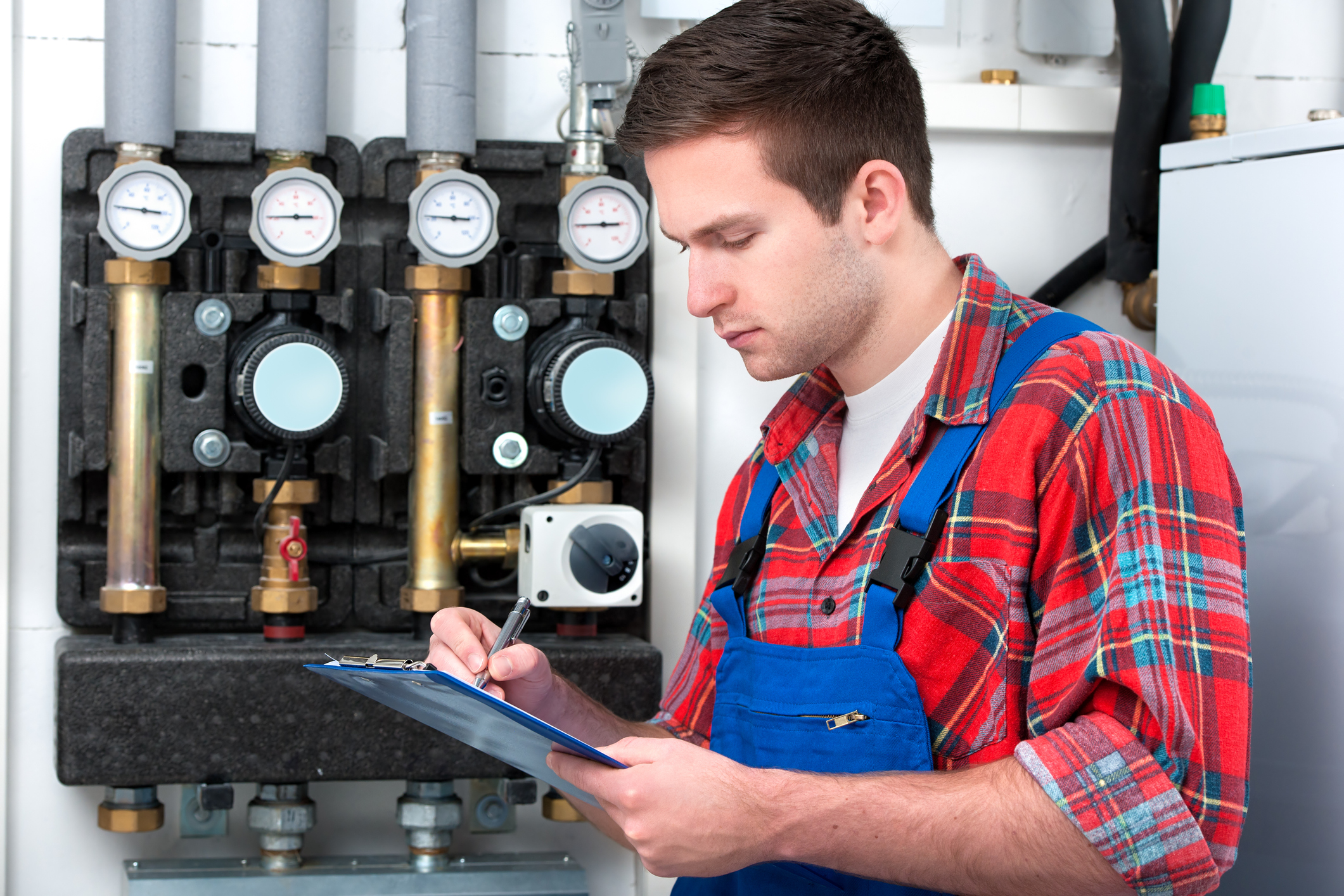 A plumber takes detailed notes to ensure every job is done right.