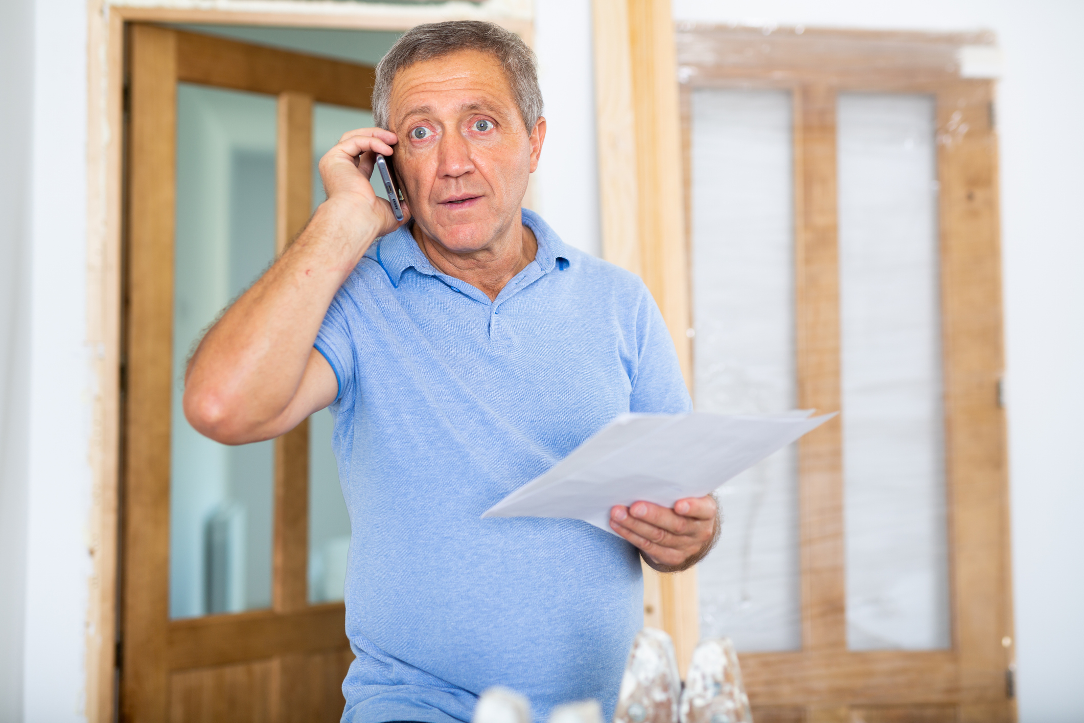 A homeowner calling a plumbing company.
