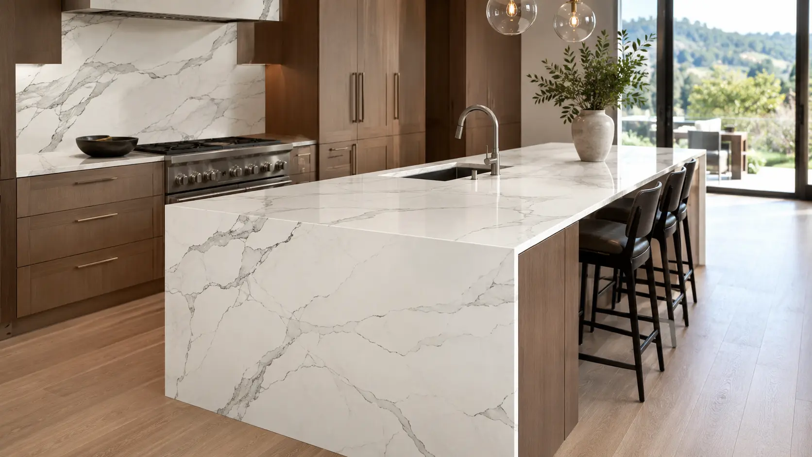 White quartz slab kitchen island with waterfall edge and matching backsplash in a luxury kitchen