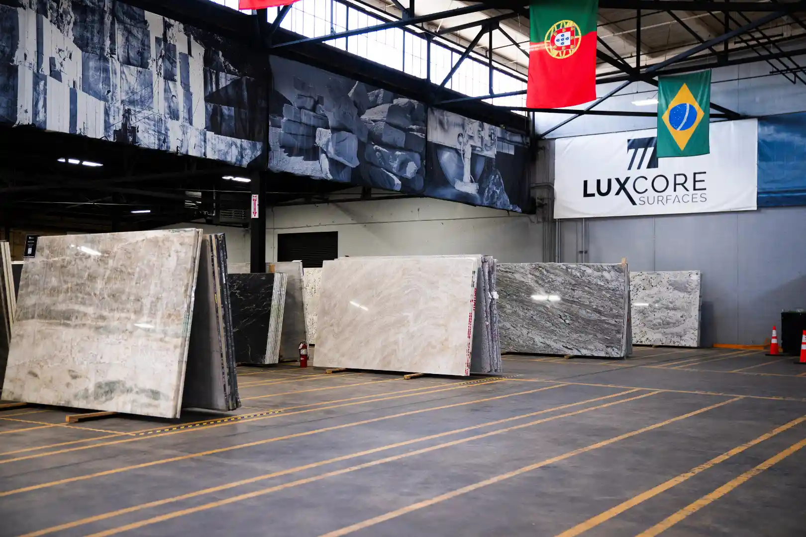 Full-size stone and quartz slabs displayed at the LuxCore Surfaces showroom in Ogden Utah