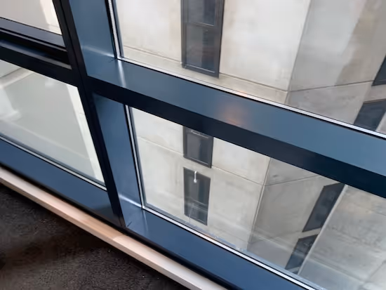 Mould removal completed leaving clean aluminium window frames