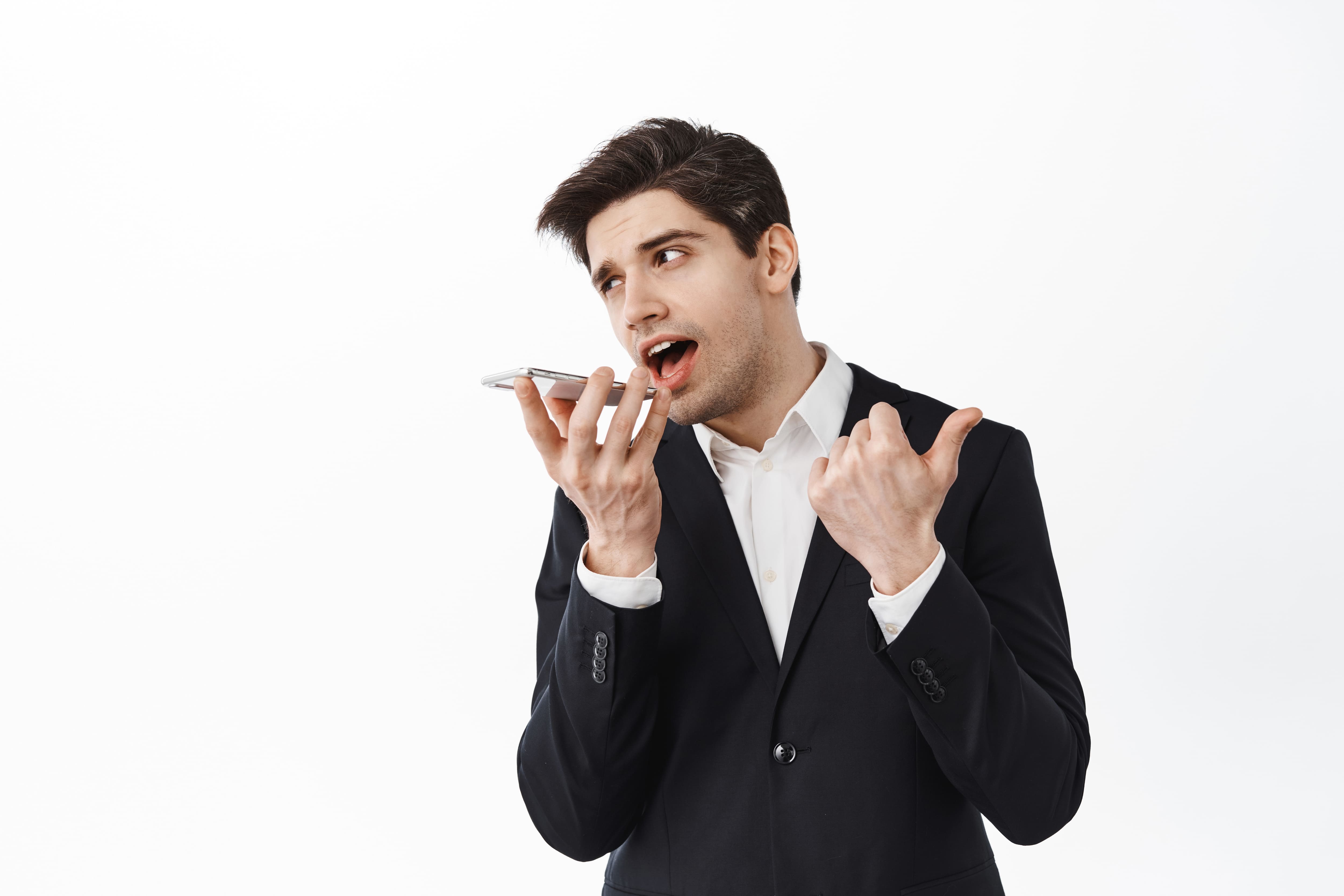 Man using smartphone voice assistant