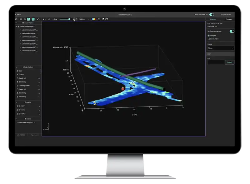 A computer monitor with GPR Insights software pictured, pipe annotations are overlaid on a heatmap of GPR signal. 