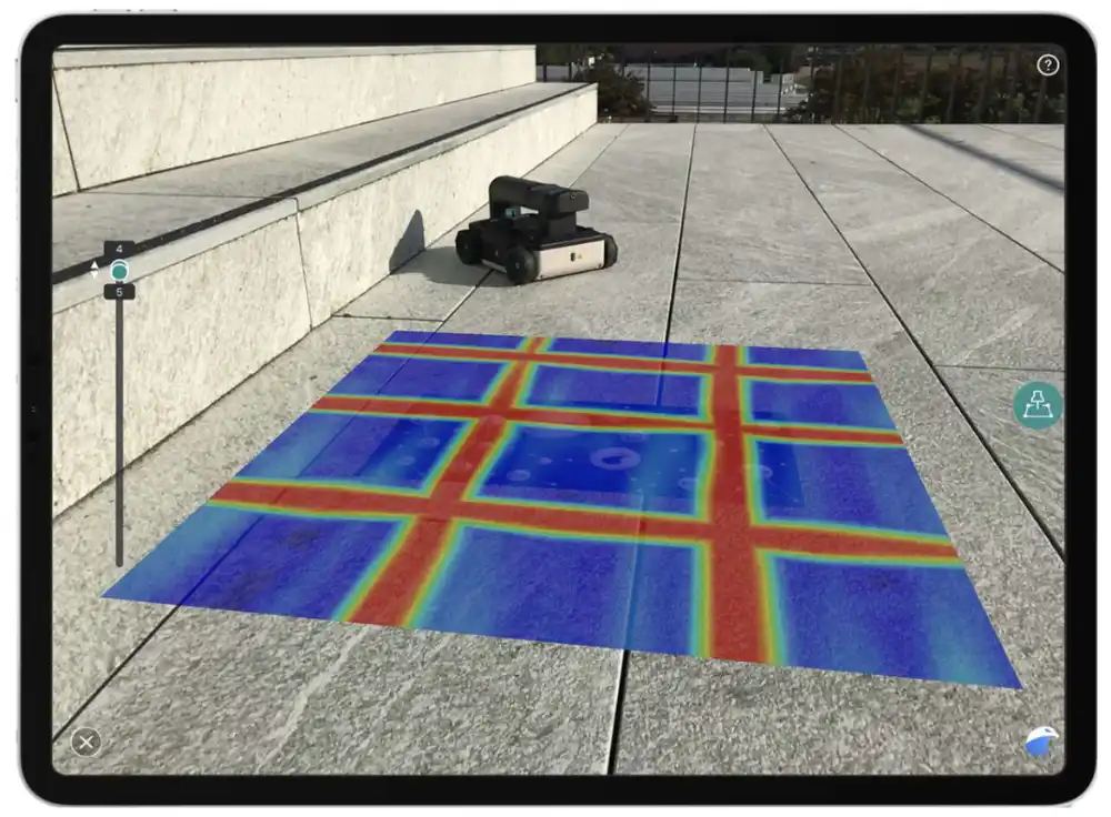 Image of an apple iPad showing a reinforcing layout projected onto a tile floor, the GP8000 scanner appears in the background