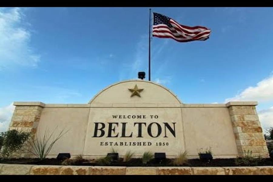 Welcome to Belton Missouri stone sign with American flag