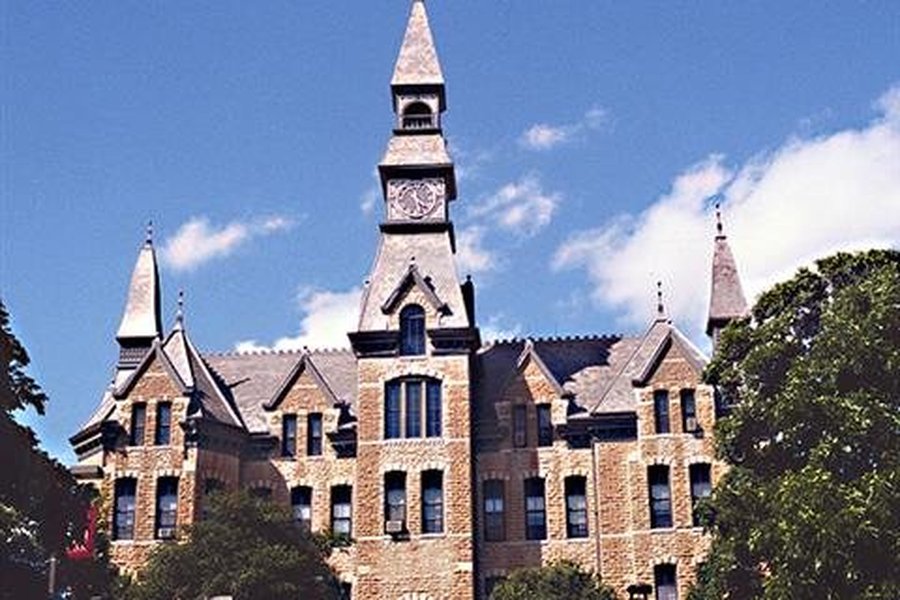Sculpture of artist with red scarf in downtown Parkville