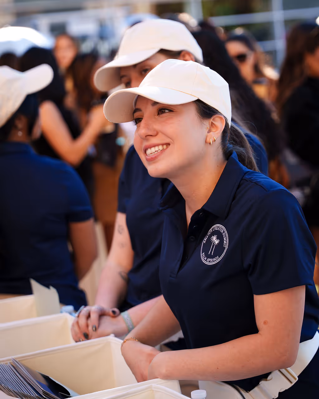 Image of a man smiling in a white hoodie with brightly colored background