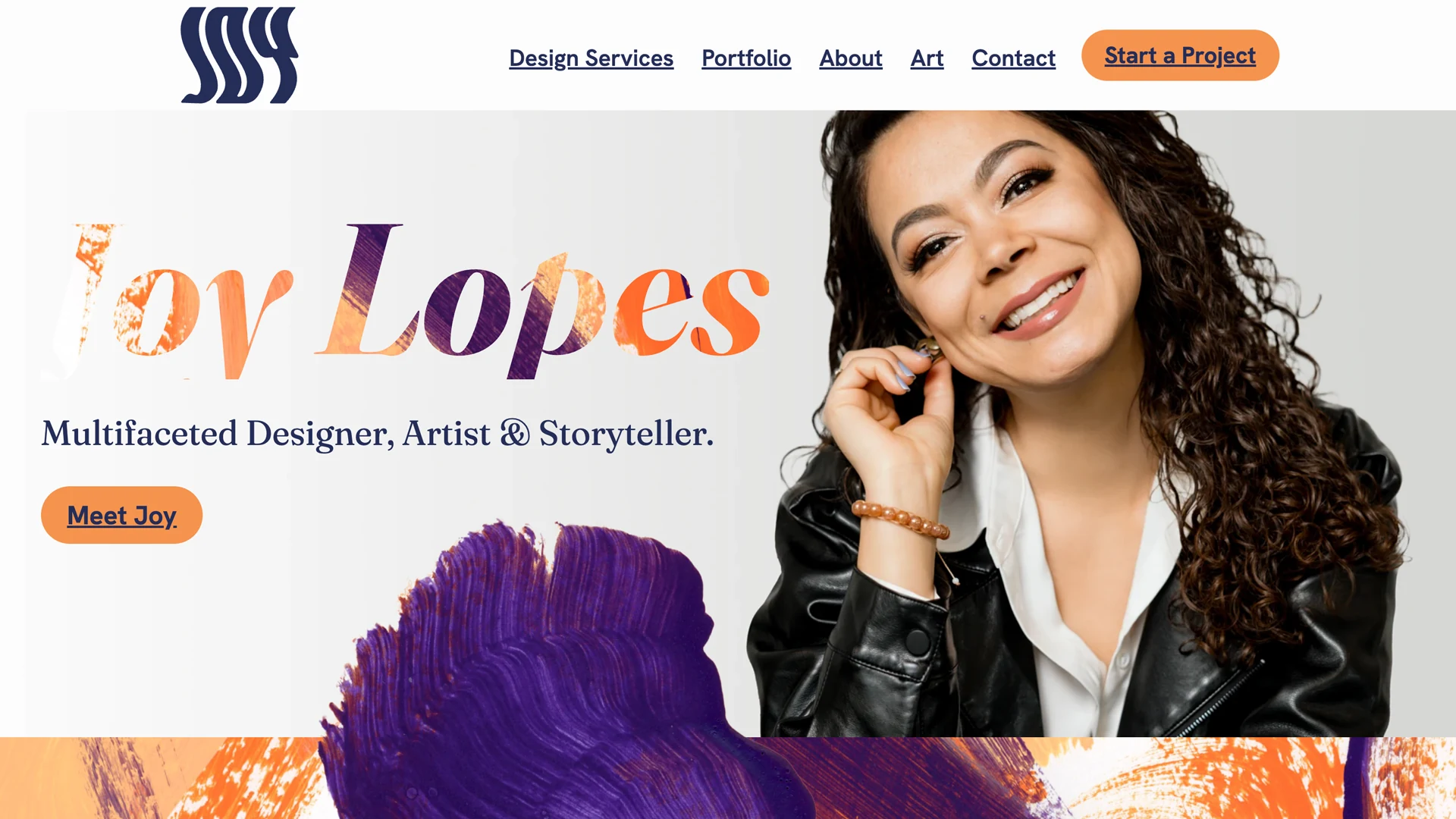 Joy Lopes, multifaceted designer, artist, and storyteller smiling