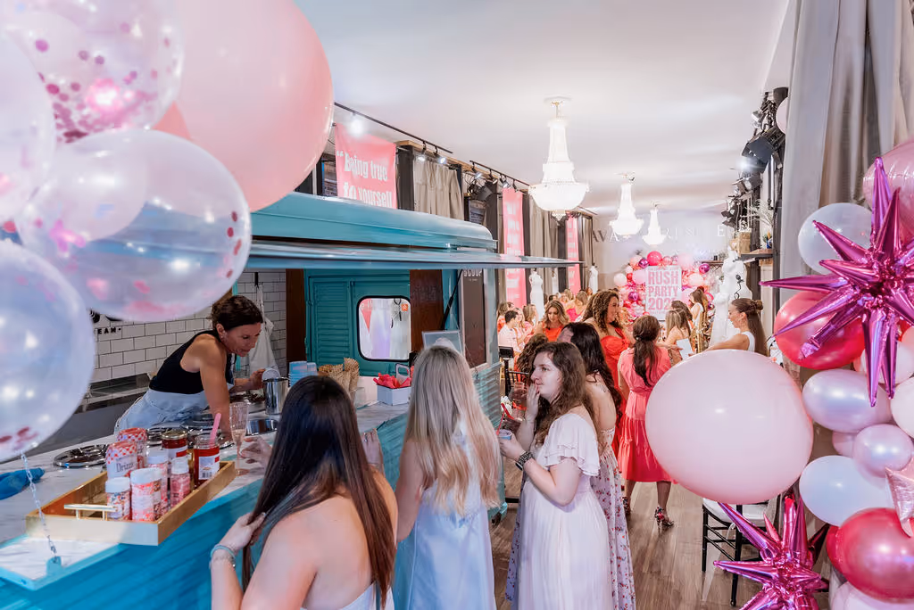 Guests enjoying a themed celebration at a bridal boutique South Carolina