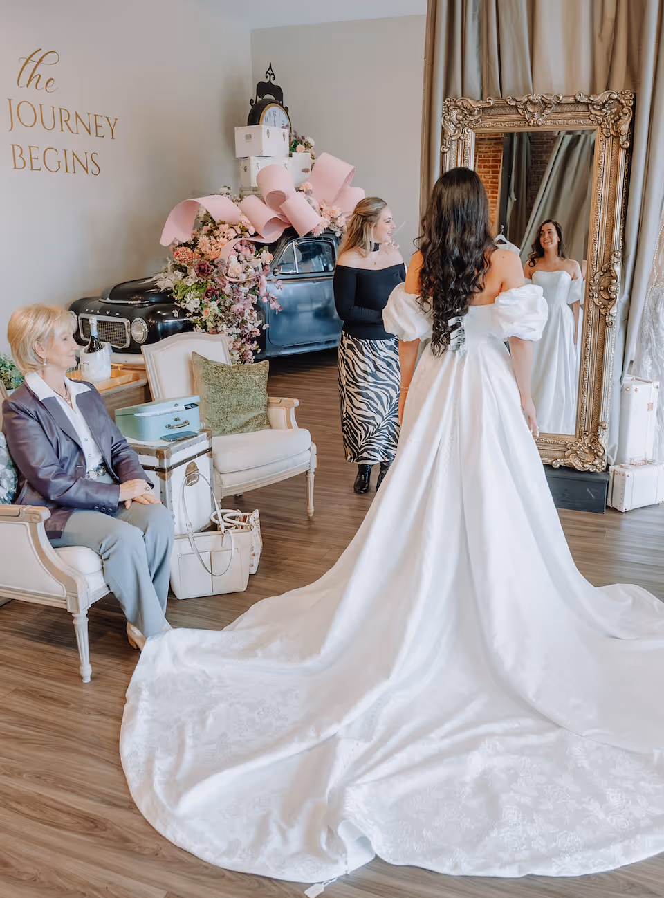 Bride trying on couture wedding dresses in Greenville SC at Ava Laurènne Bride wedding dress shop Greenville SC