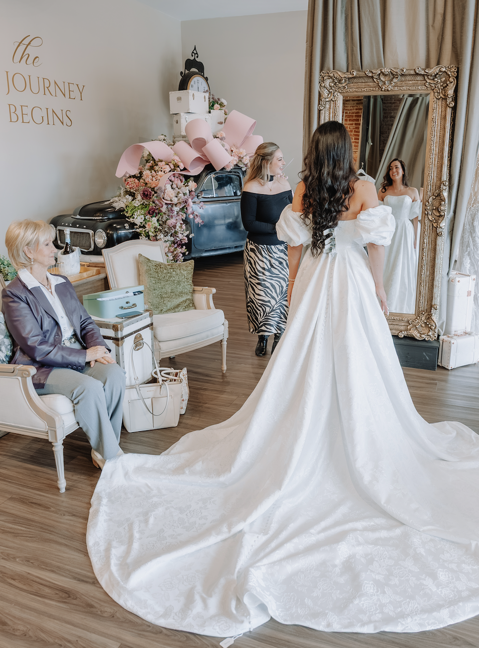 Bride trying on couture wedding dresses in Greenville SC at Ava Laurènne Bride wedding dress shop Greenville SC