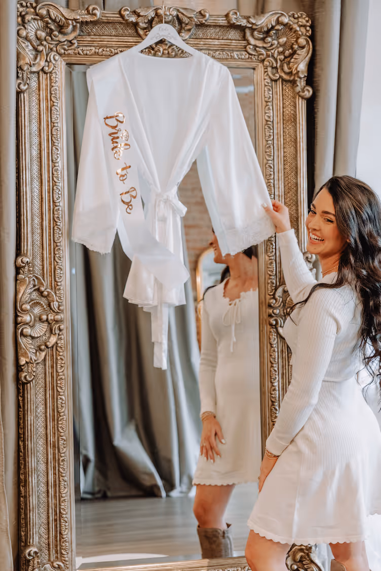 Bride celebrating in a stunning ball gown at wedding dress shop Greenville SC