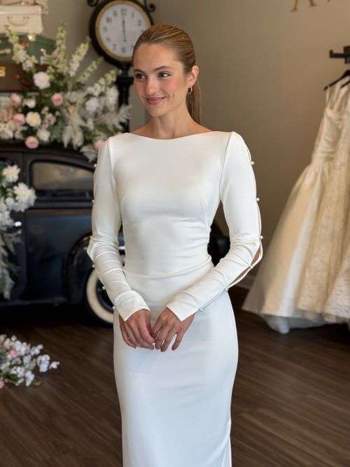 Romantic fitted lace wedding dress with illusion bodice and long sleeves in South Carolina bridal boutique