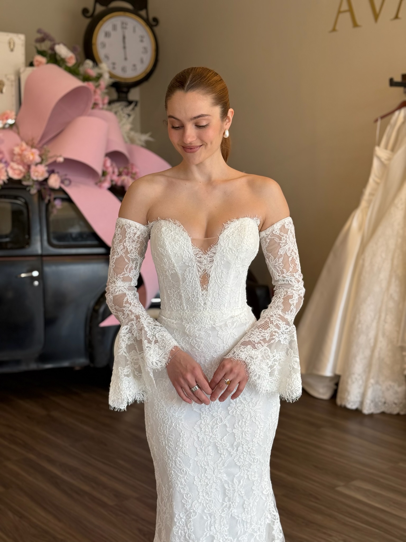 Romantic fitted lace wedding dress with illusion bodice and long sleeves in South Carolina bridal boutique