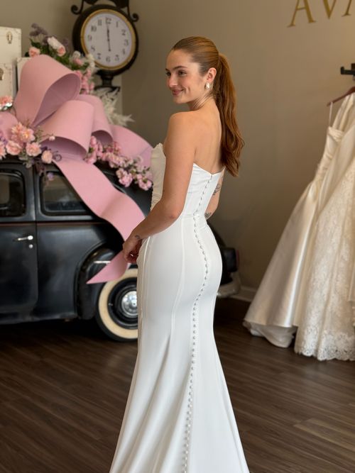 Romantic fitted lace wedding dress with illusion bodice and long sleeves in South Carolina bridal boutique