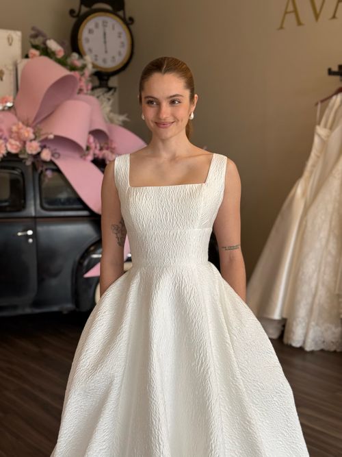 Bride wearing a textured square neckline ball gown wedding dress at Ava Laurénne Bride in Greenville SC
