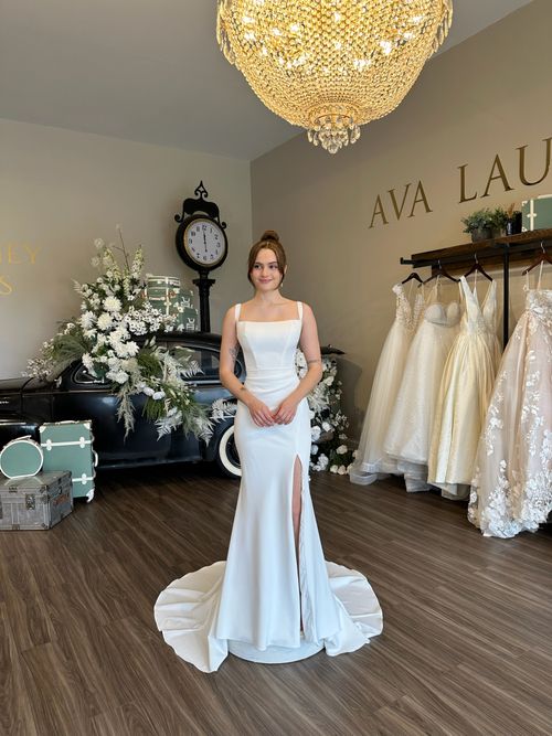Romantic lace square neckline ball gown wedding dress with matching lace gloves at Ava Laurénne