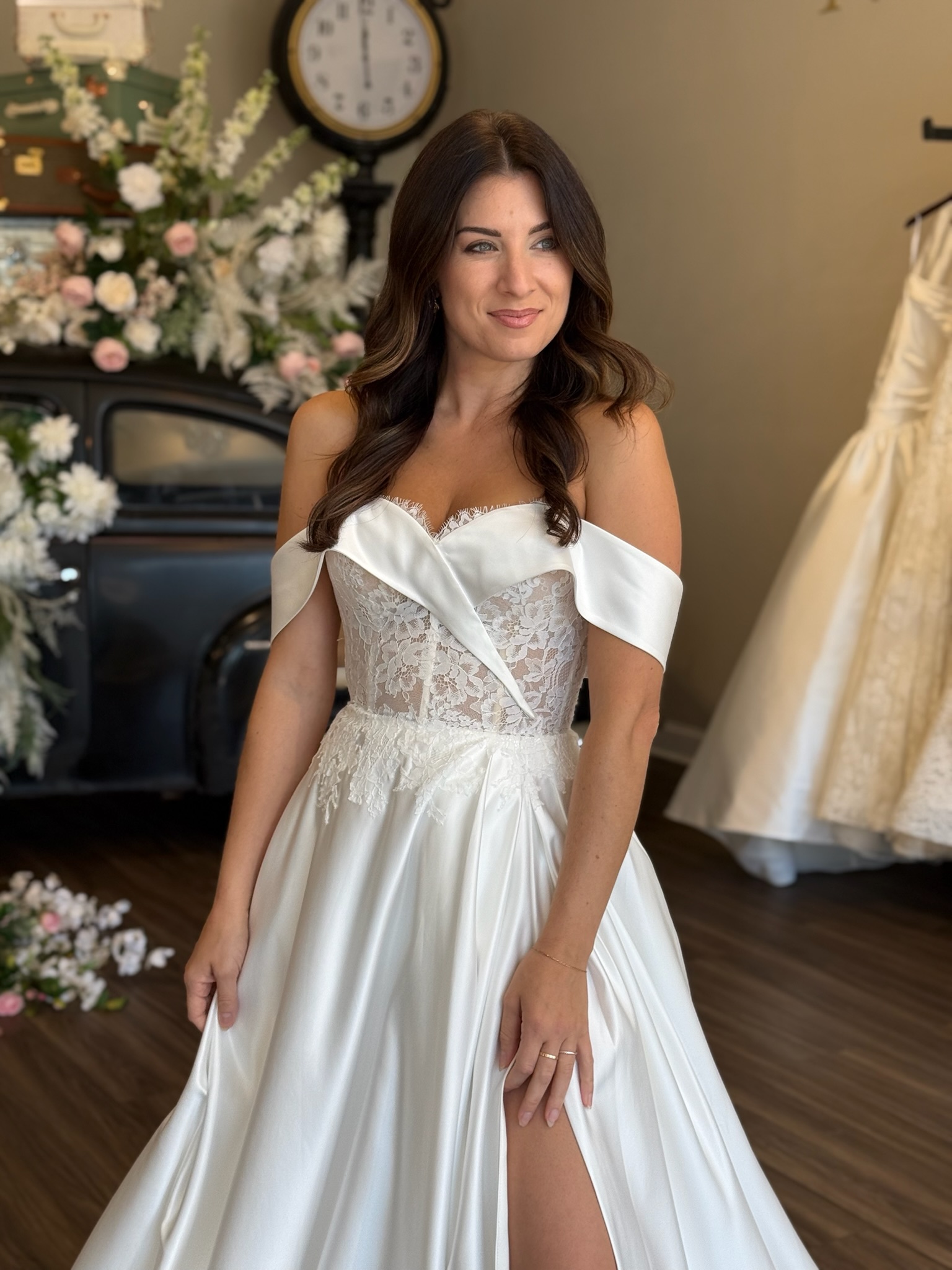 Bride wearing a fitted sweetheart neckline wedding gown with intricate lace detailing