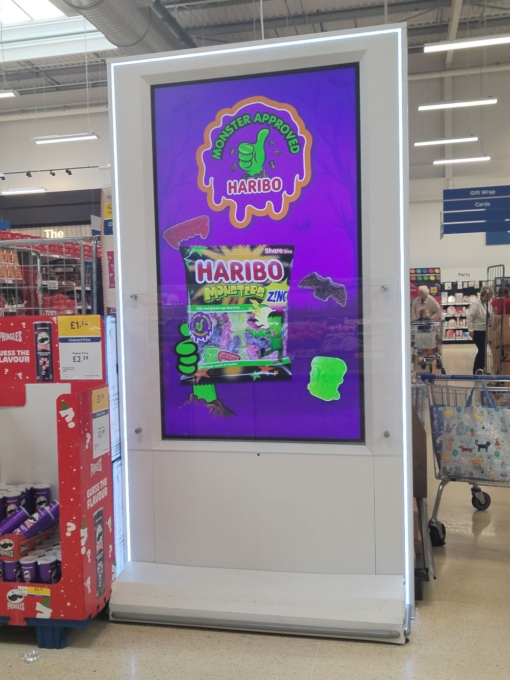 Digital screen in Tesco showing a Halloween Haribo advert