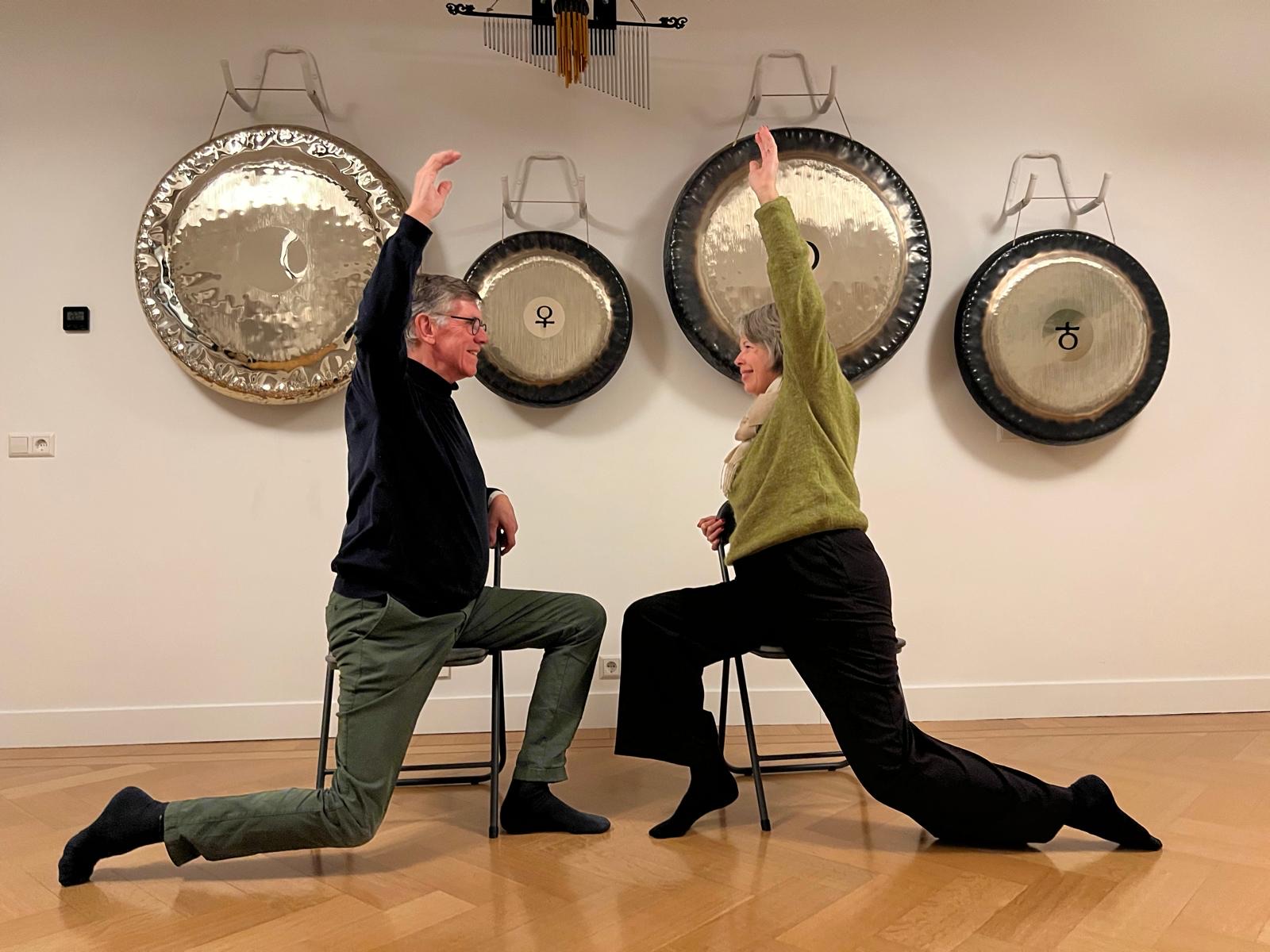 two people doing yoga for parkinson