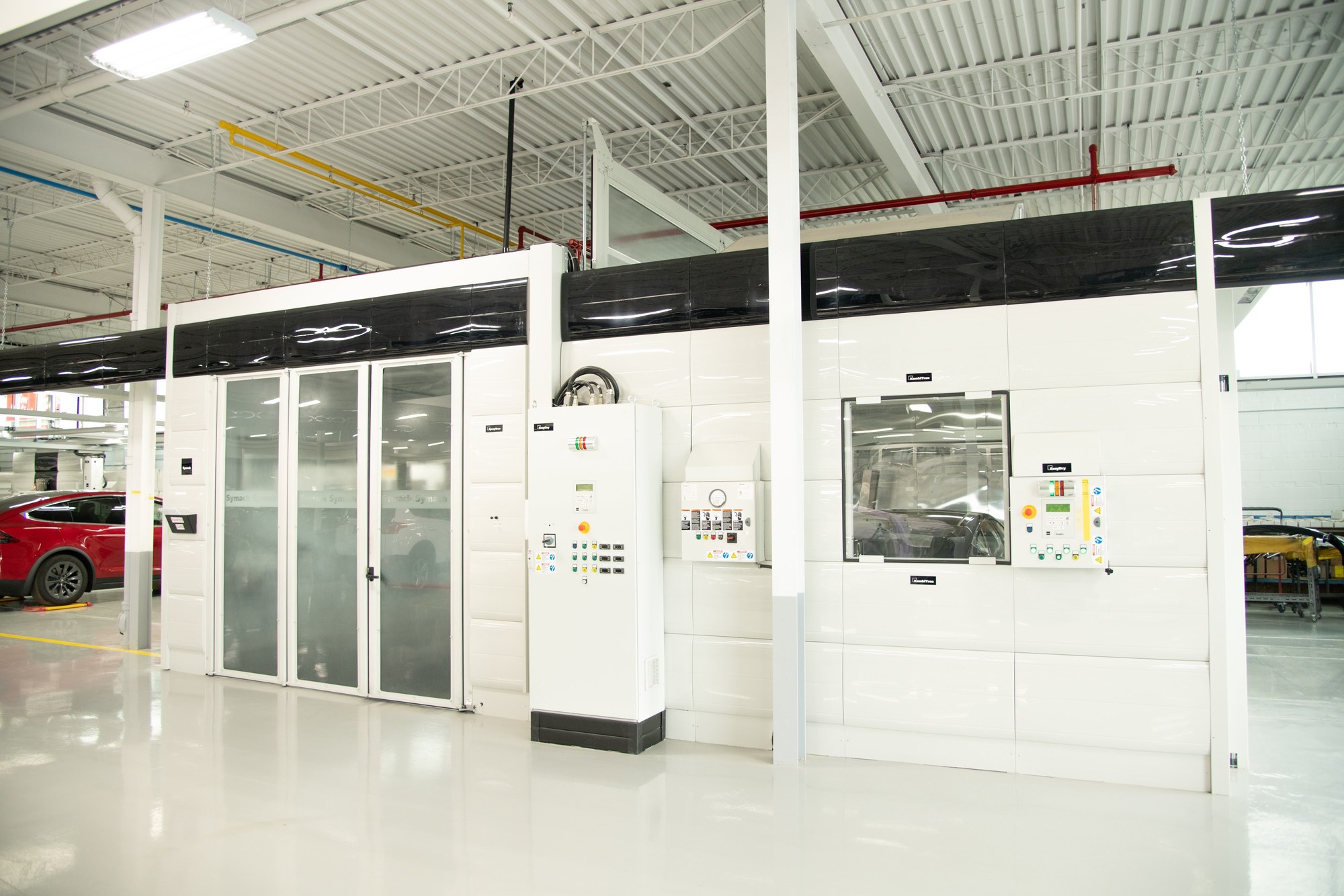 Symach paint booth and its control panels inside CSN 427 Auto Collision in Etobicoke