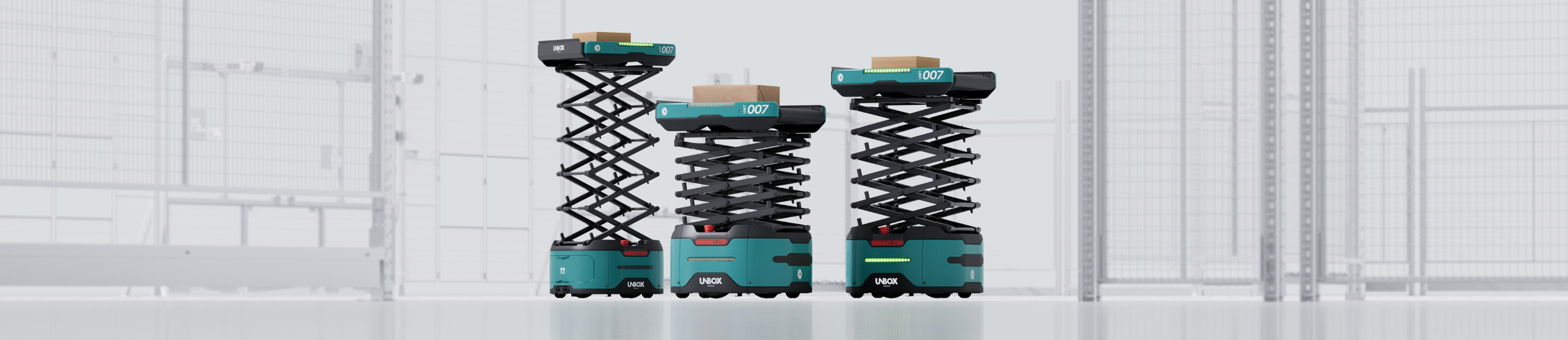 Three UnboxSort robots at different lift heights carrying parcels