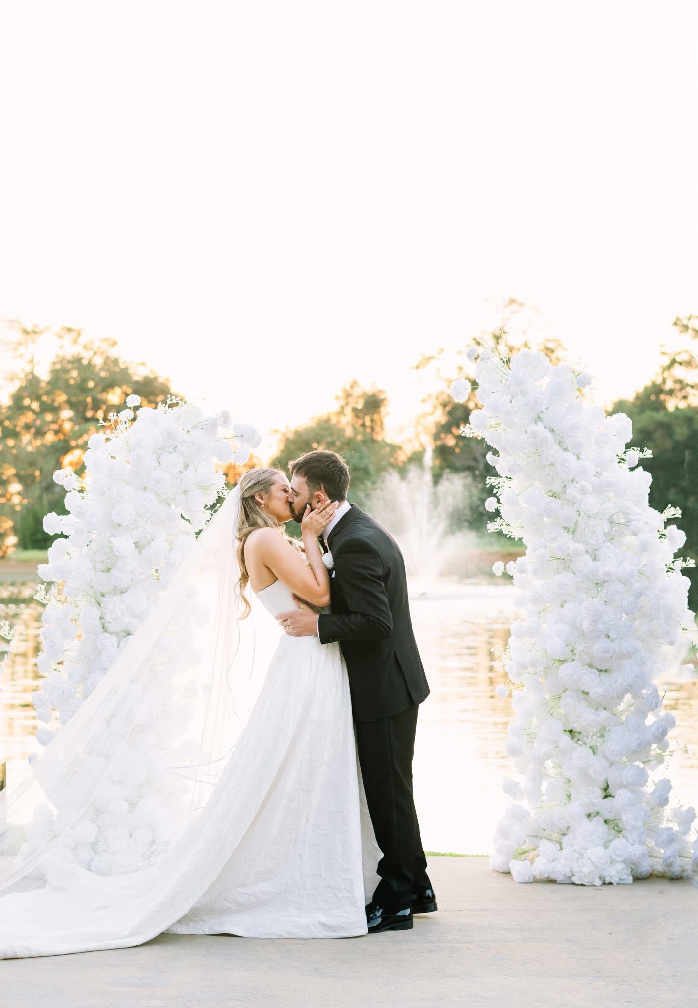 The Best spot in Louisiana for your Timeless Southern Wedding - The Wolf Hill Sunset Peninsula. With handmade arches and benches on a waterfront with a water fountain!