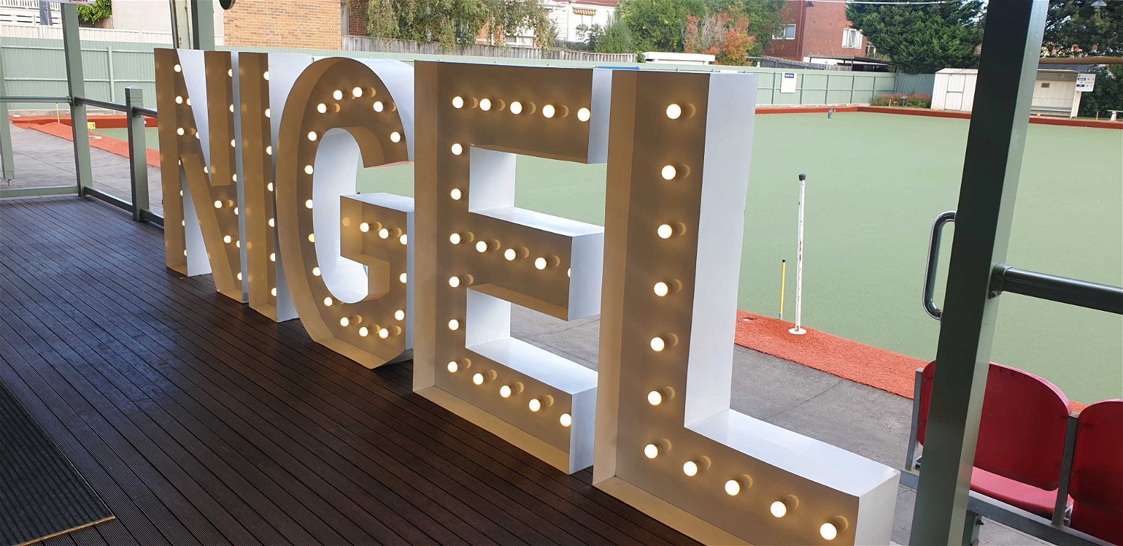 Nigle's name in lights as he is celebrated during his living memorial.