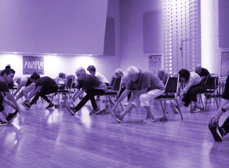 Seniors stretching in a community center class for Membership at the local Jewish Community Center.
