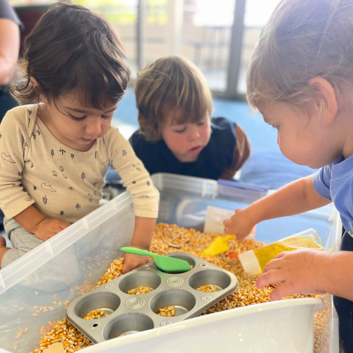 young toddlers playing in a sensory class room