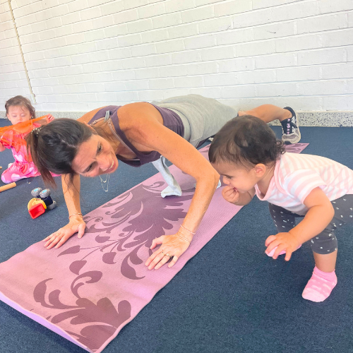 Baby & me parent in fitness class with cute children enjoying the activity