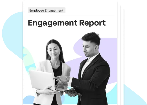 Two professionals reviewing an employee engagement report on a laptop and tablet.