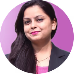 Portrait of a woman with long dark hair wearing a black blazer and pink top against a purple background.