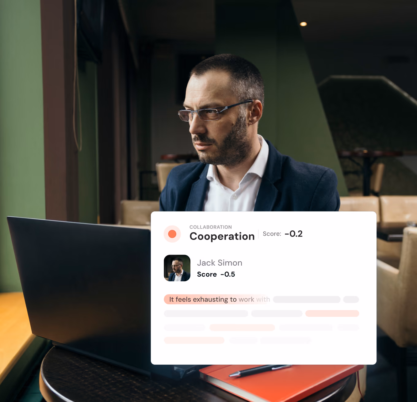 Man wearing glasses and a dark blazer sitting at a table with a laptop and notebooks, looking thoughtfully to his left, with a digital overlay showing a collaboration sentiment analysis score of -0.2, and a profile for Jack Simon with a score of -0.5 and highlighted text stating 'It feels exhausting to'.