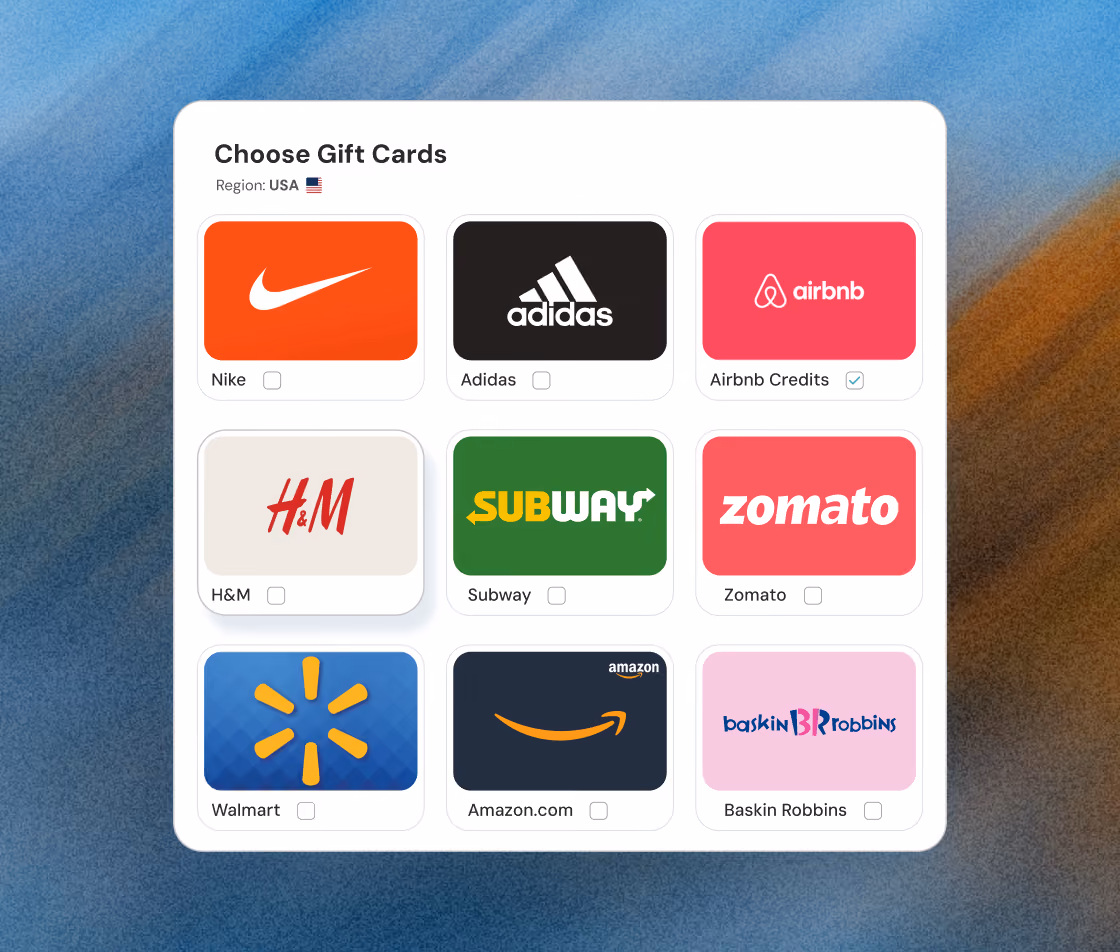 User interface displaying a selection of gift cards with logos and checkboxes for Nike, Adidas, Airbnb Credits (checked), H&M, Subway, Zomato, Walmart, Amazon.com, and Baskin Robbins, labeled with 'Choose Gift Cards' and region USA.