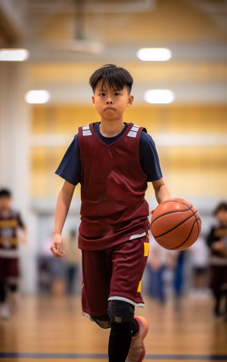 photo of boy playing basketball
