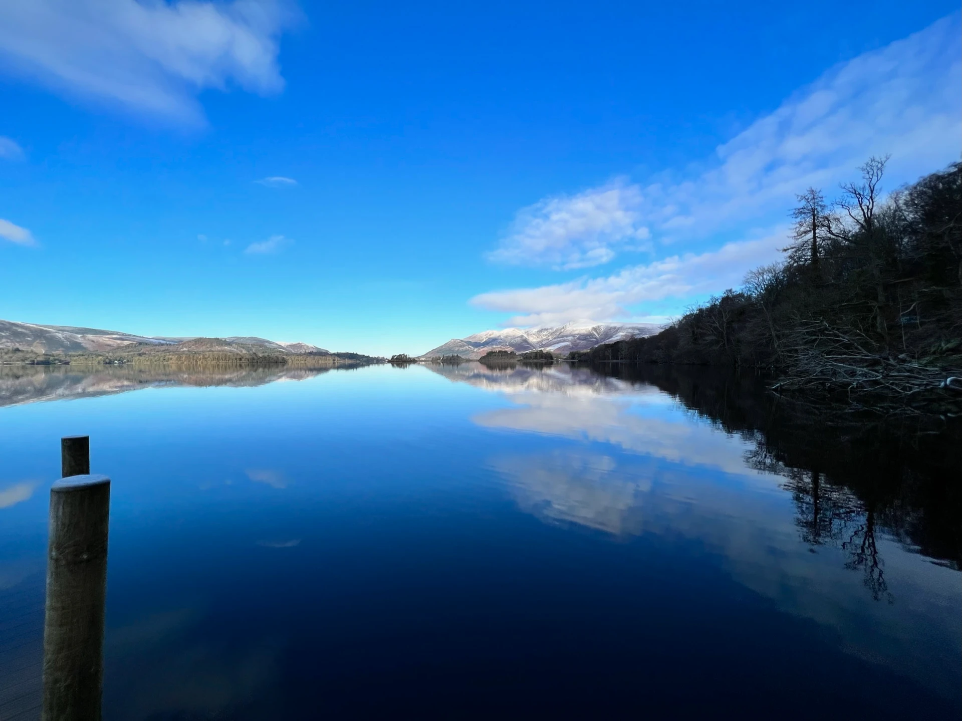 Picturesque view of the Northern lakes in the lake district with the impressive hills in the distance