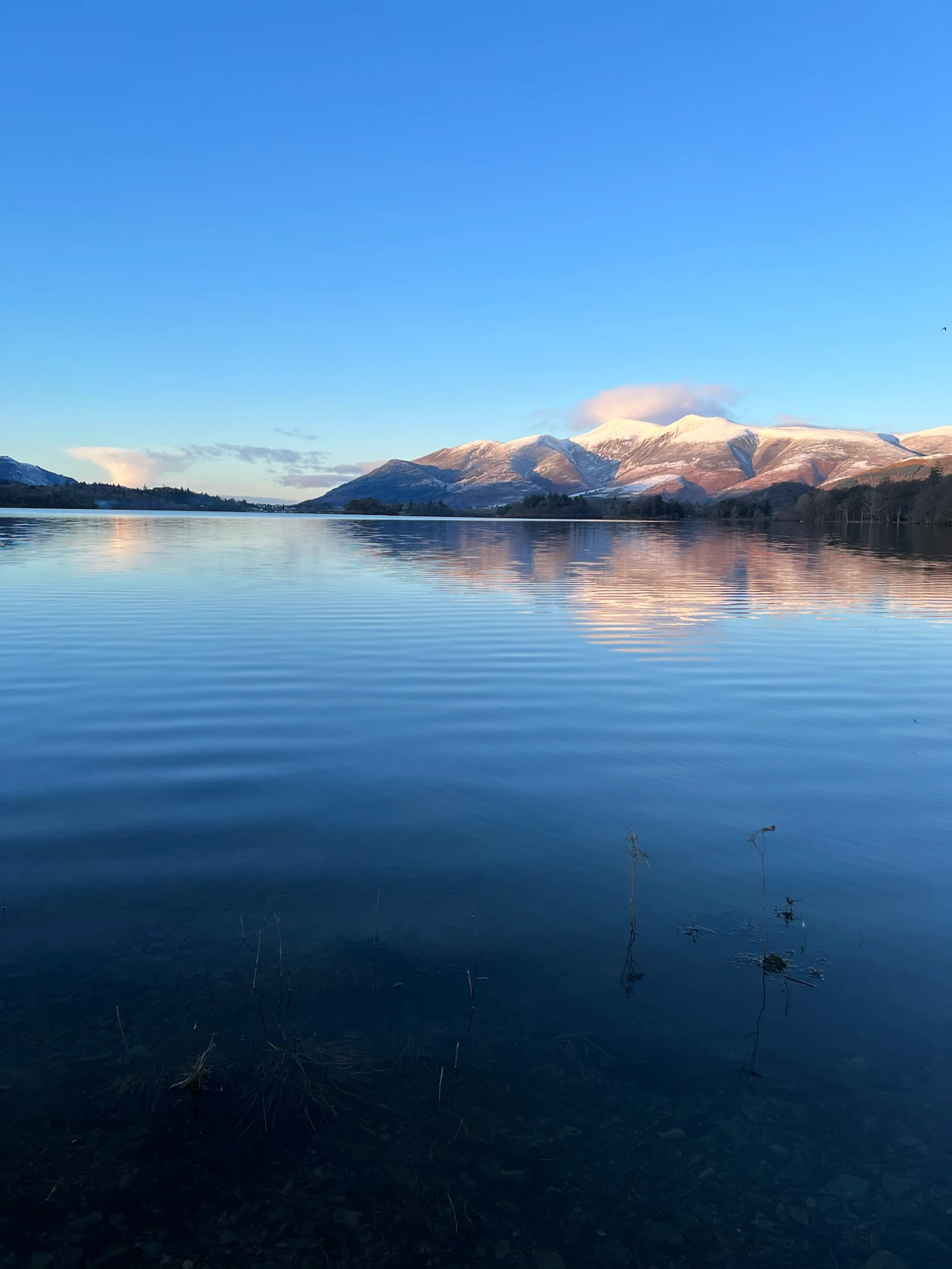 Picturesque view of the Northern lakes in the lake district with the impressive hills in the distance