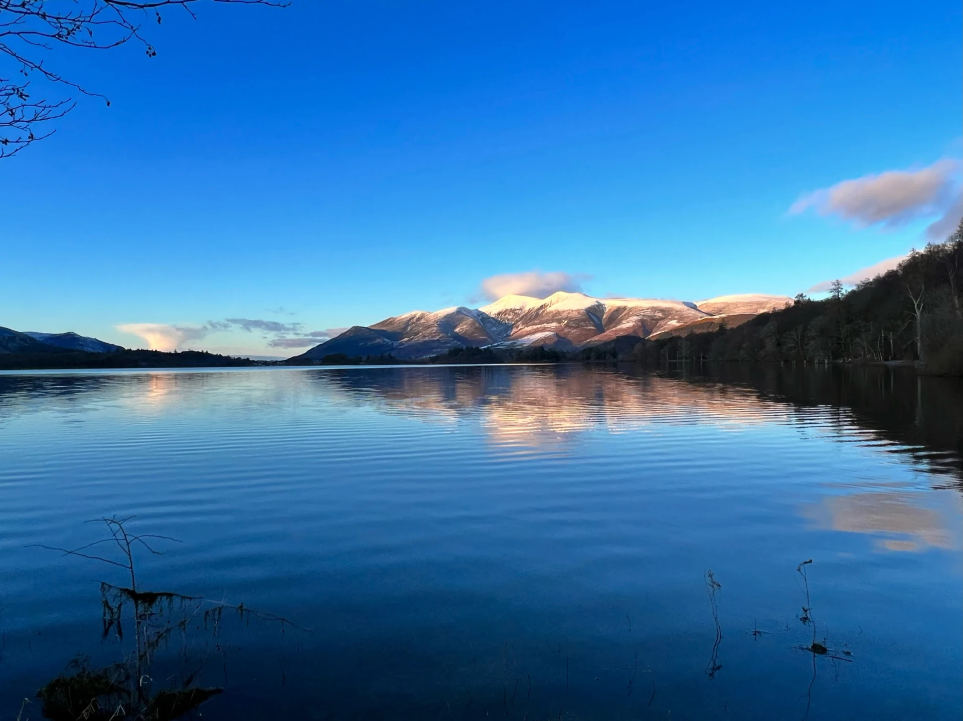 Picturesque view of the Northern lakes in the lake district with the impressive hills in the distance