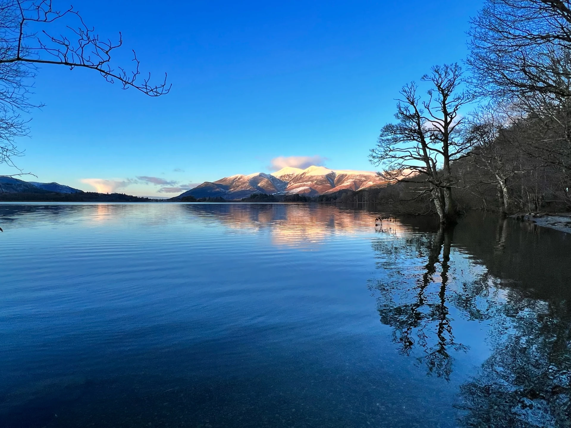 Picturesque view of the Northern lakes in the lake district with the impressive hills in the distance