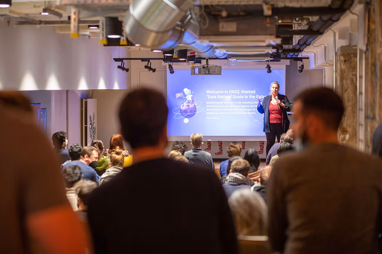 Cloud containing emojis representing AI apps, data and LLM models on a soft blue gradient background