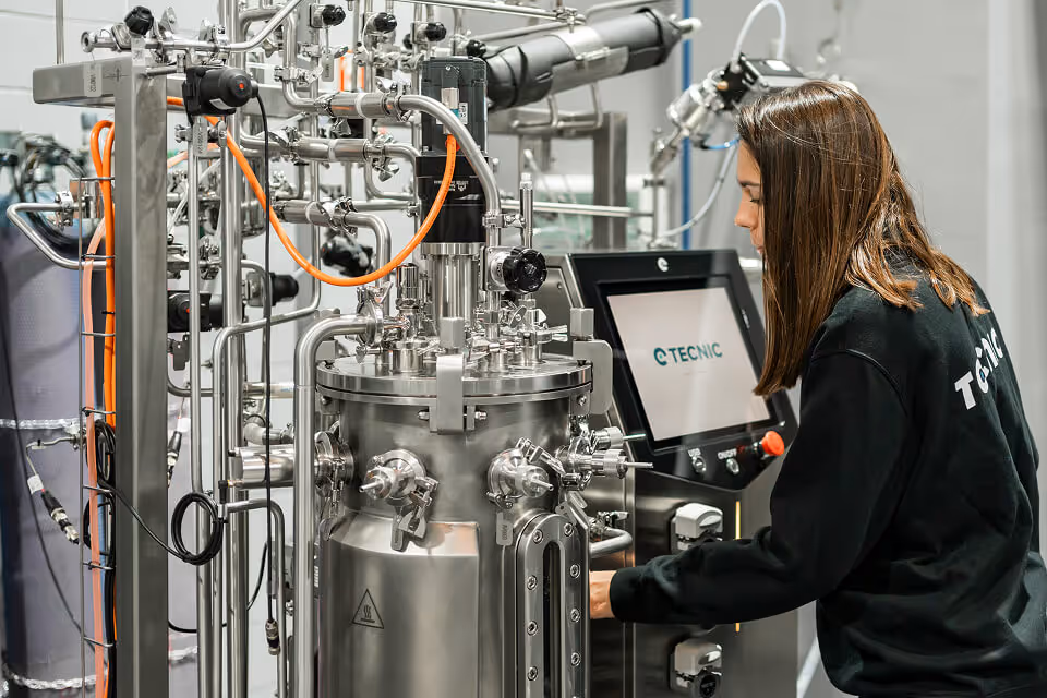 A female engineer adjusting technical machinery