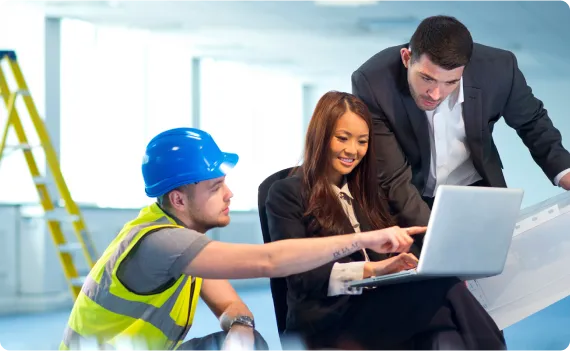 a couple of people that are looking at a laptop