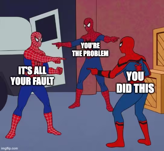 Three Spider-Man characters stand in a circle pointing at each other, each blaming the others. Text labels say ‘It’s all your fault,’ ‘You’re the problem,’ and ‘You did this.