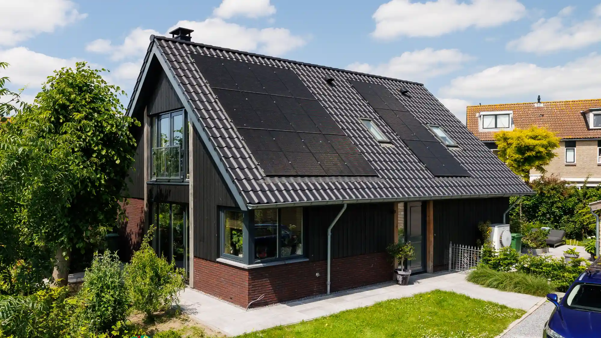 Vrijstaande schuurwoning met houten gevelbekeding