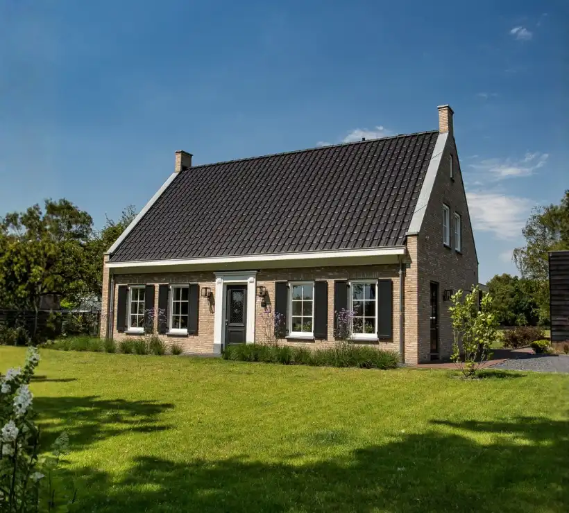 Vrijstaande woning met een cottage bouwstijl