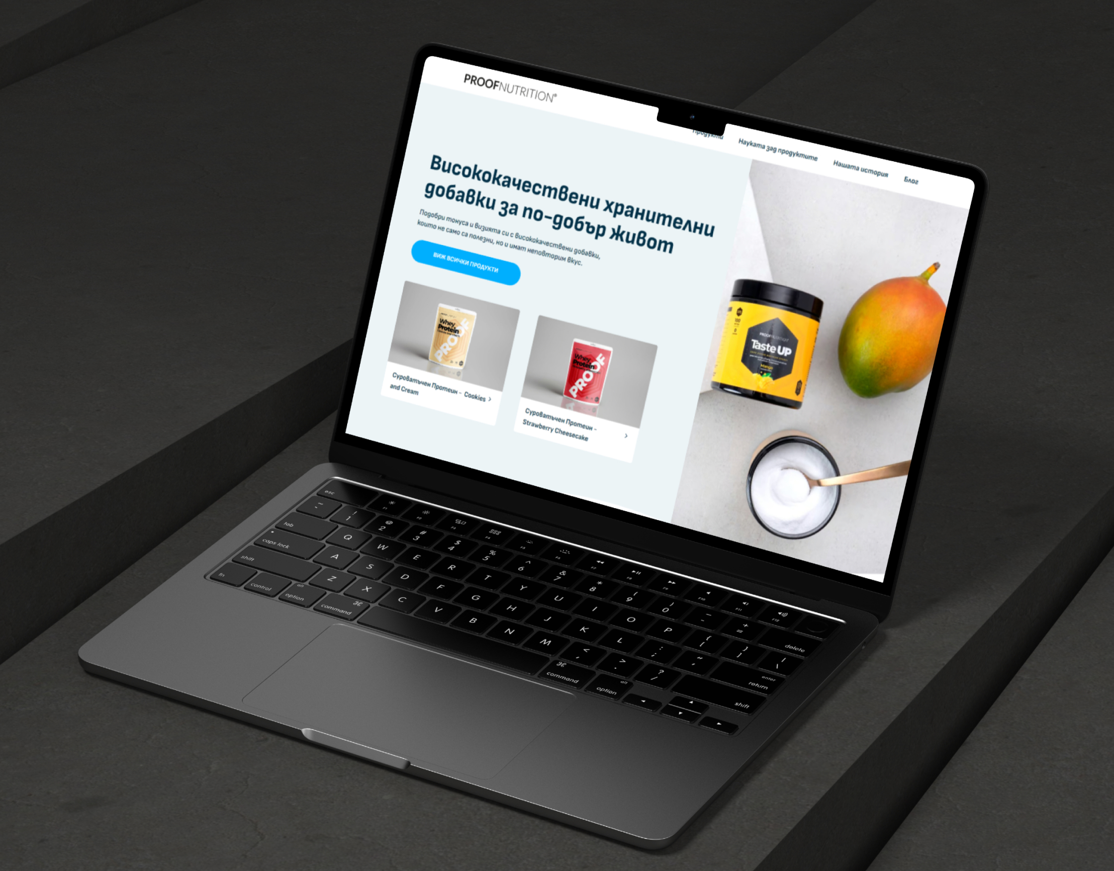 Proof Nutrition homepage on a laptop mockup, with the Taste UP tub, a mango and whey protein product cards