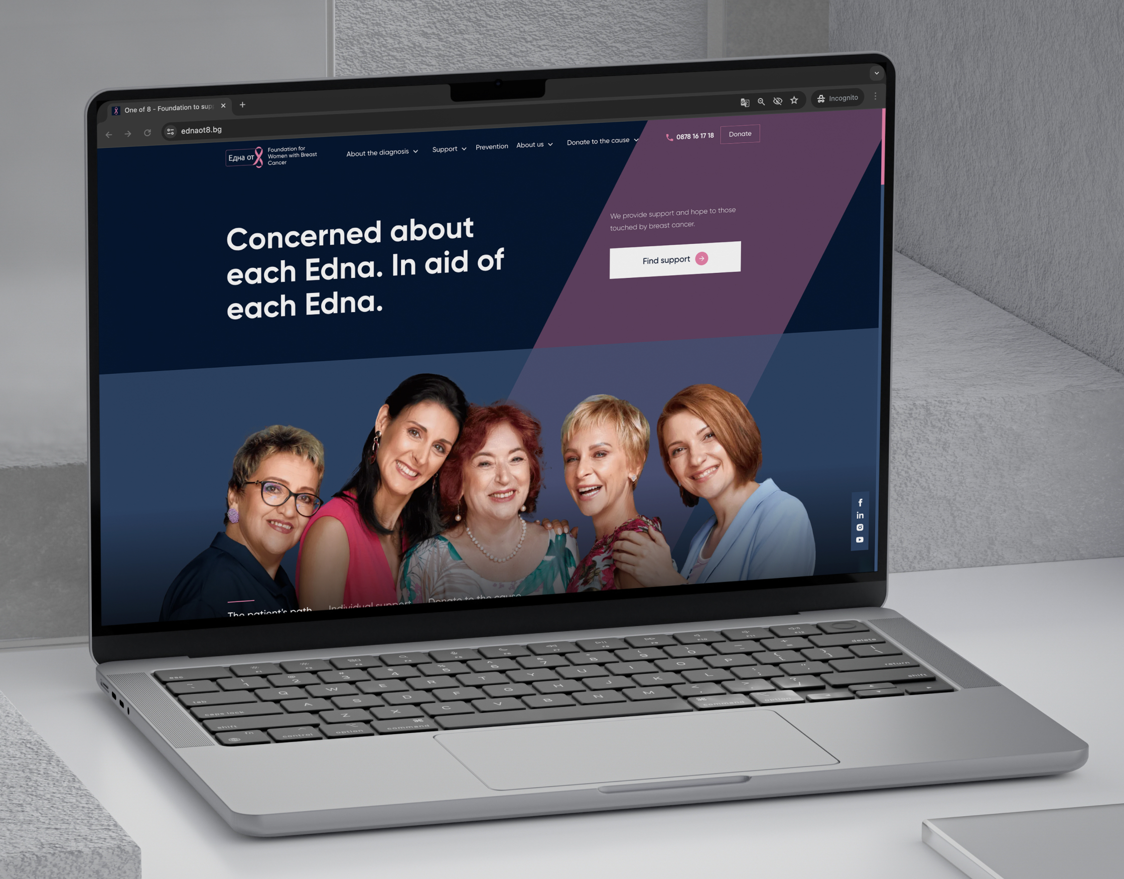 One of 8 homepage in English on a laptop mockup, with the navy hero and group portrait of five women