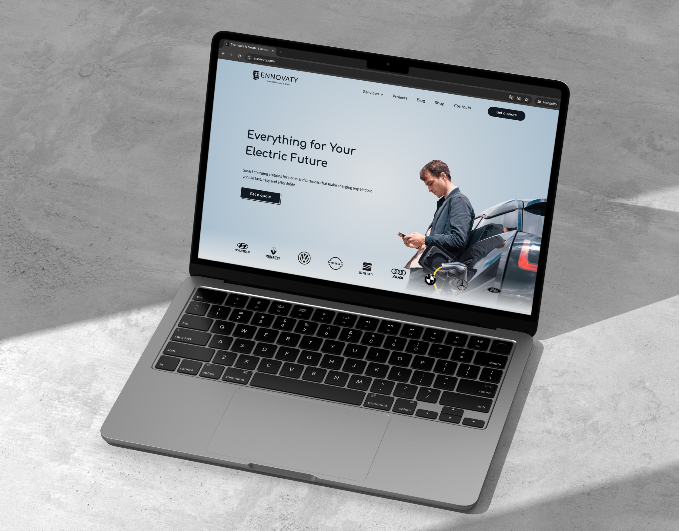 Ennovaty homepage on a laptop mockup showing the Everything for Your Electric Future hero and car brand logos