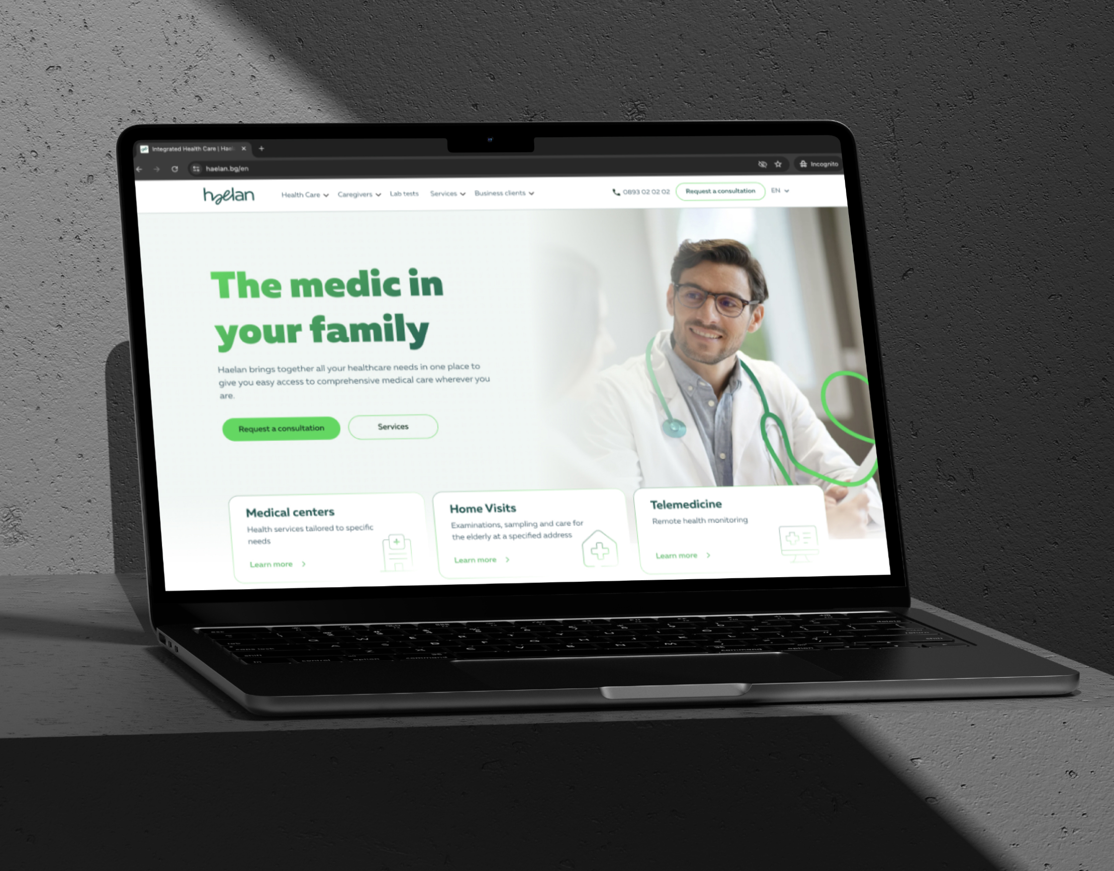 Haelan homepage on a laptop mockup with a green headline about family medical care and three service cards